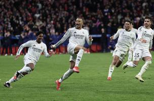 Real Madrid avancou na Liga dos Campeoes ao eliminar o rival Atletico de Madrid (Foto: Thomas Coex/AFP)